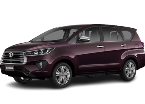 A stylish dark purple Toyota Innova, a multi-purpose vehicle (MPV), is parked facing right. It features a sleek design with modern headlights, a prominent front grille, and alloy wheels. The vehicle has tinted windows and a spacious interior, visible from the side.